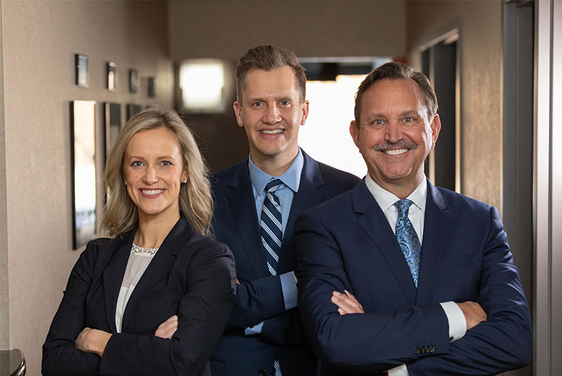 all three doctors standing with arms folded