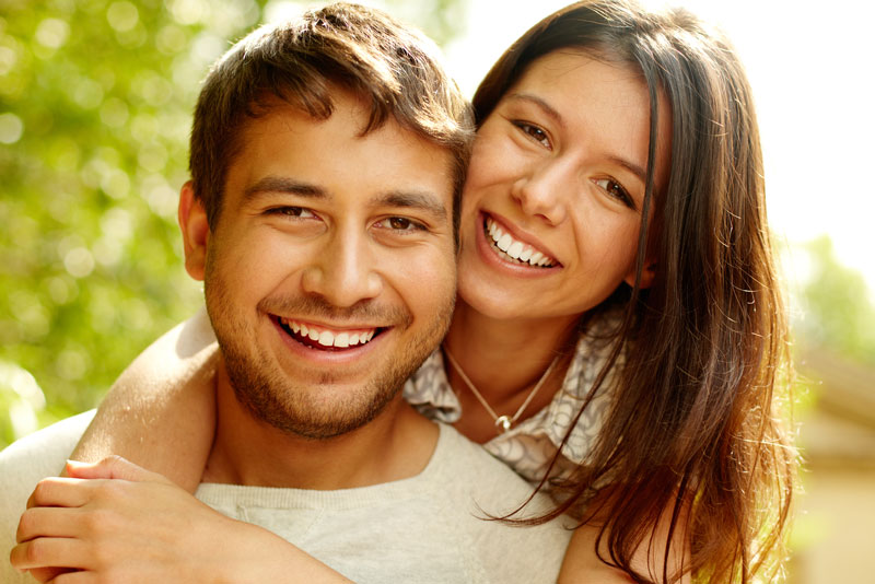 Dental Patients Smiling With Well Cared For Dental Implants In Plymouth, MN